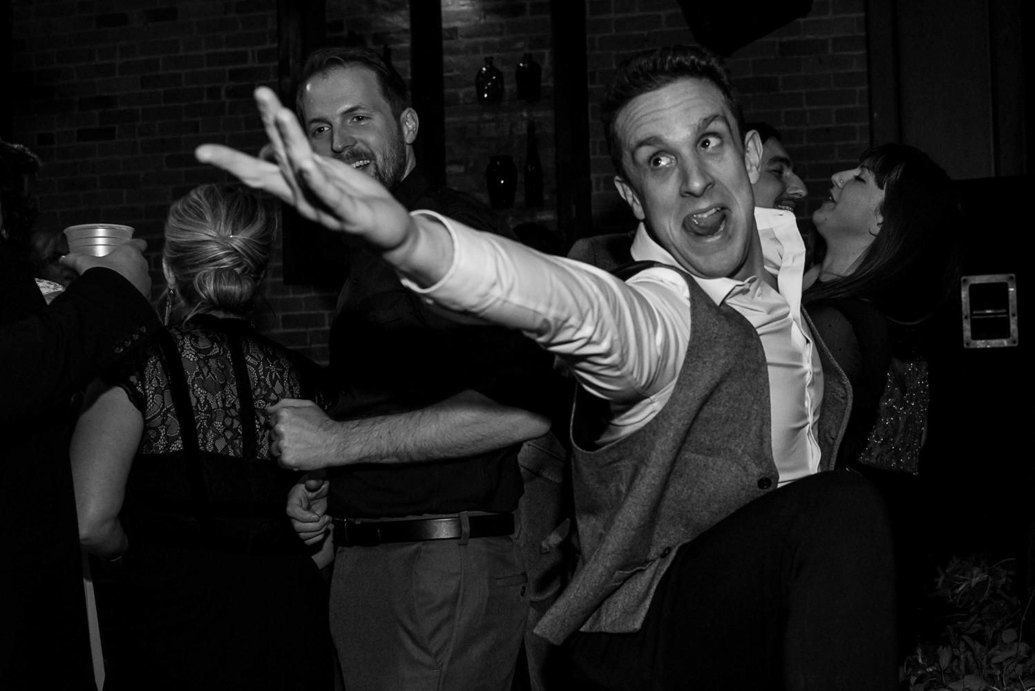groomsman enthusiastically dancing at Turtle's 1890 Social Centre