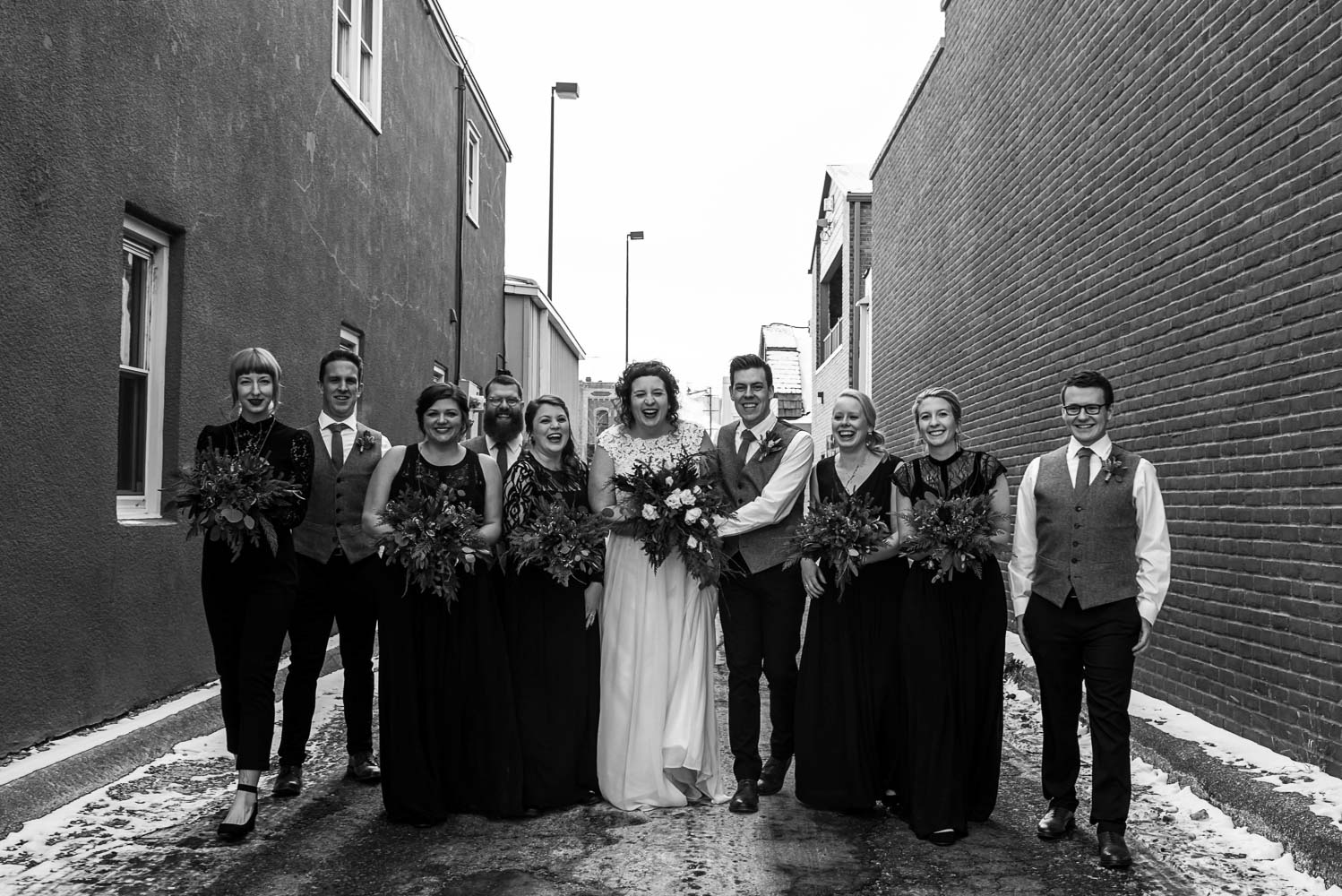 wedding party walking in the alley behind Turtle's 1890 Social Centre