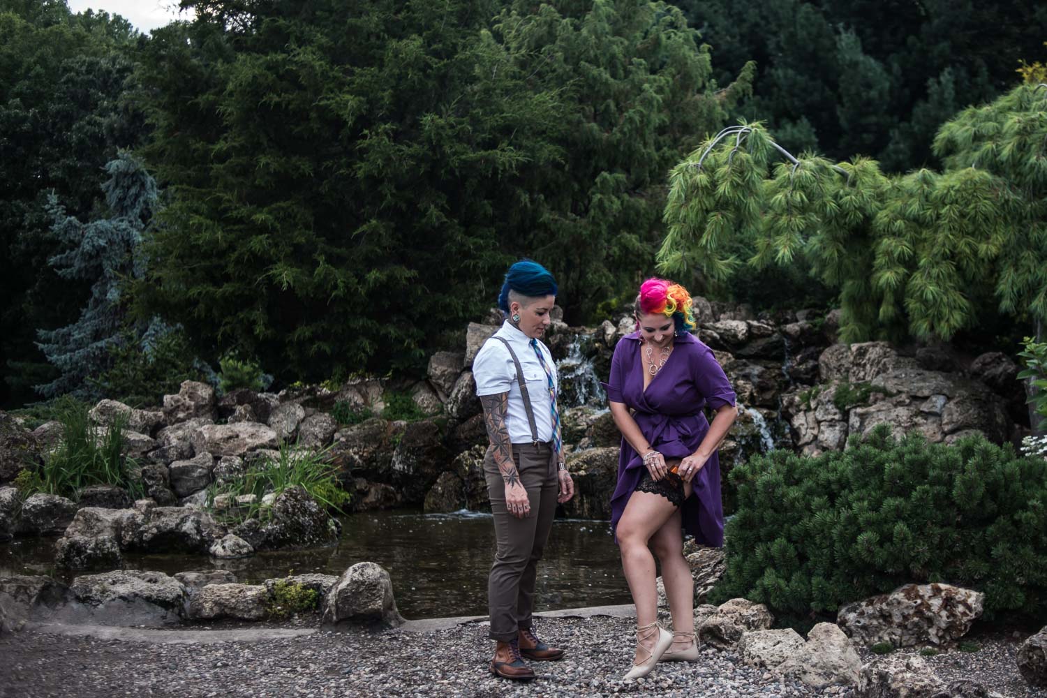 woman in a purpcle dress proposing to her girlfriend at the Peace Garden in Minneapolis