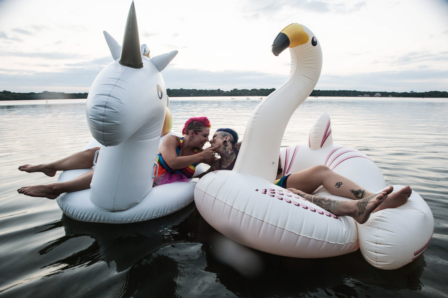 LGBTQ on Lake Harriet riding a unicorn and flamingo kissing