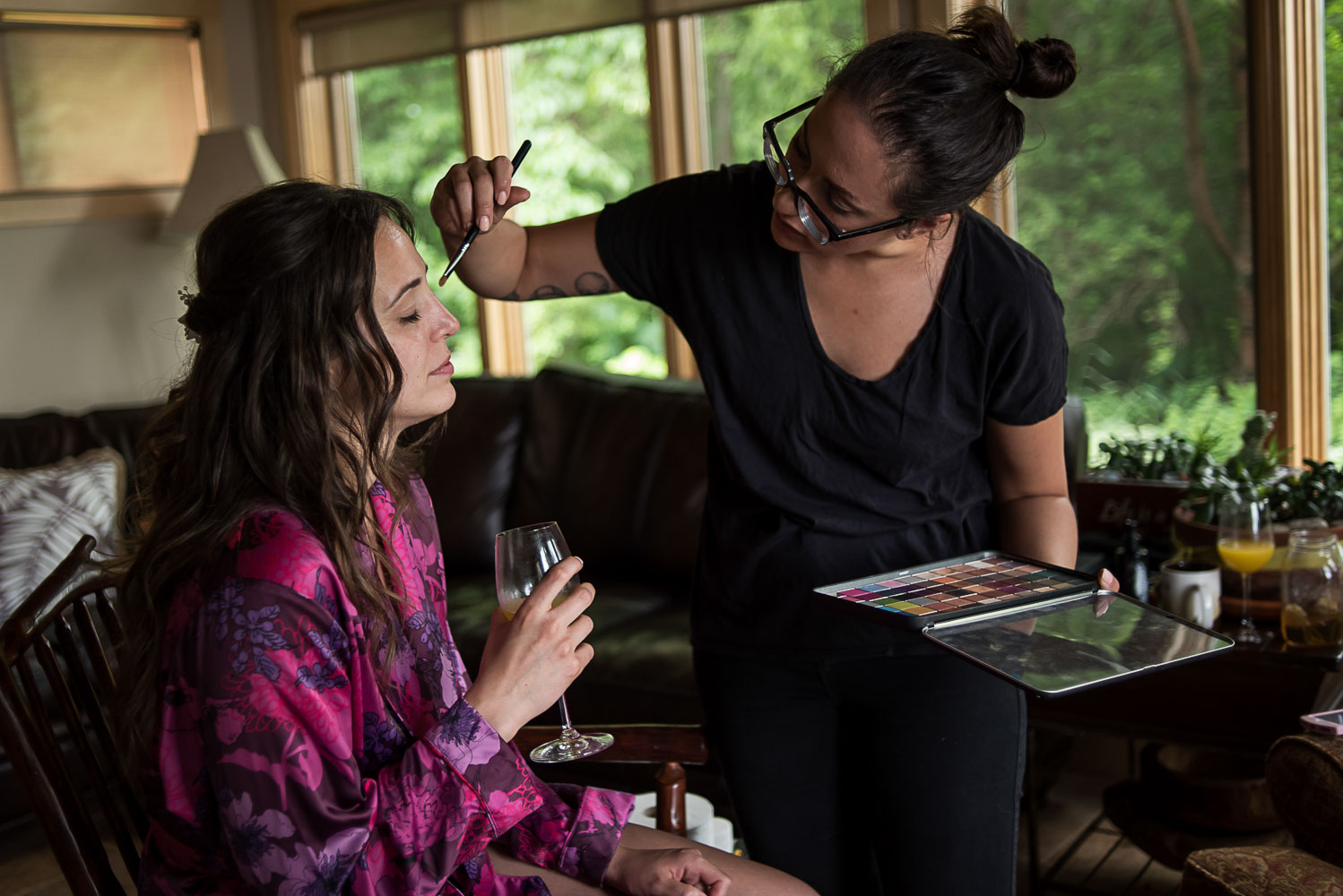 bride getting her makeup on at her parents home in Victoria Minnesota