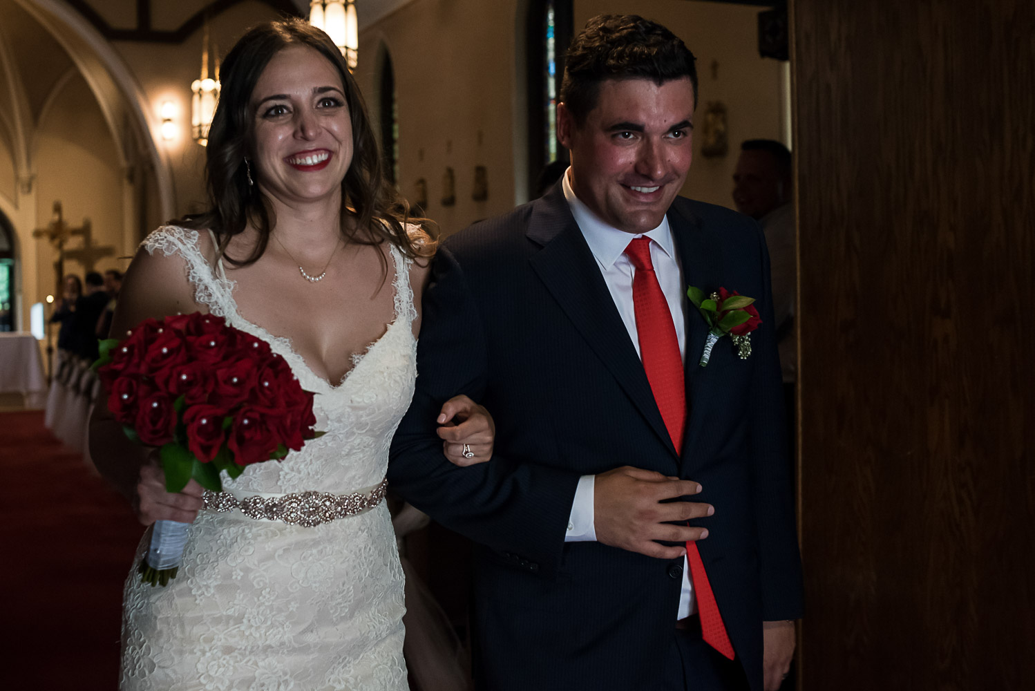 bride and groom leaving the church after their wedding ceremony at St. Victoria Catholic Church