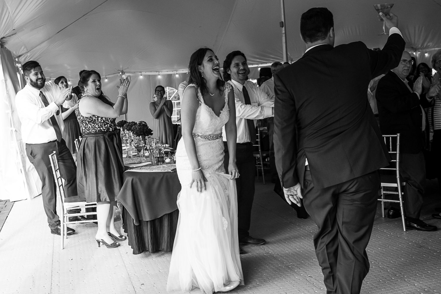 bride and groom walking into the ceremony dancing and celebrating at the Winery at Sovereign Estate